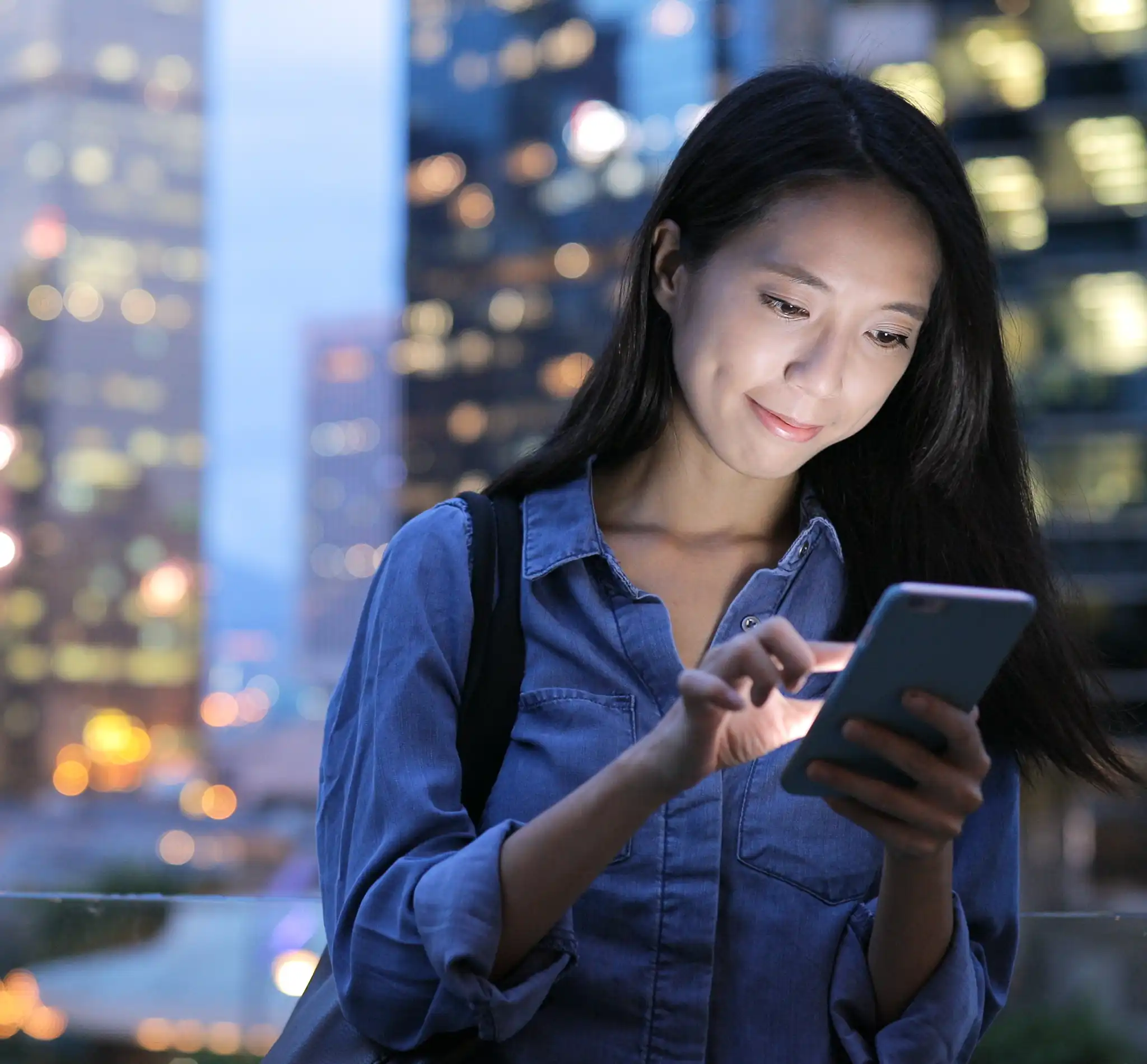 Lady on her phone in the city