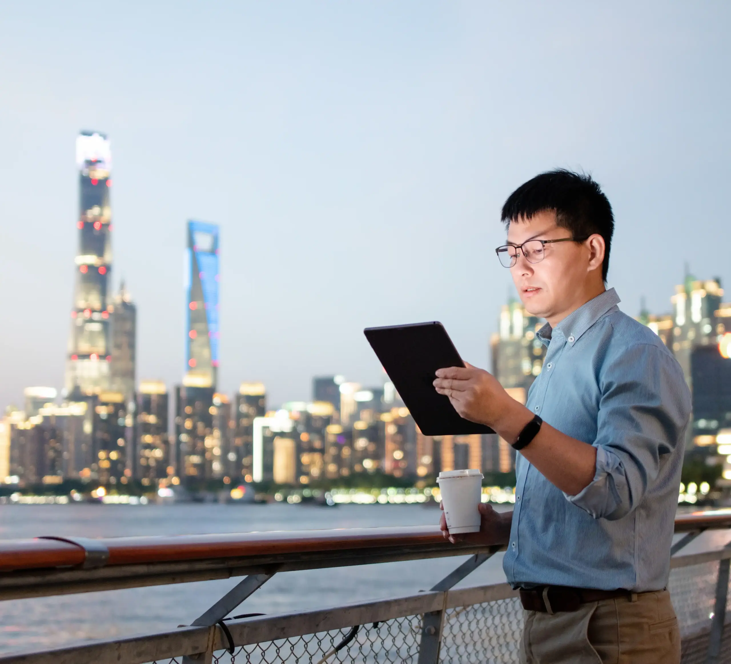 Business man working abroad with his iPad