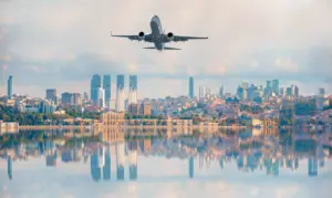 Plane flying over city