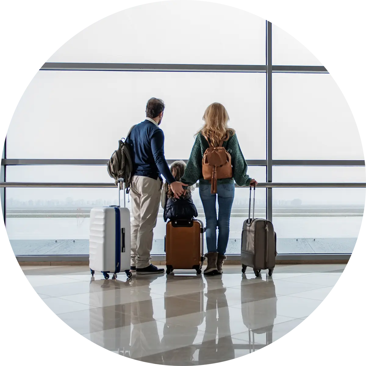 Family with suitcases preparing to get on flight