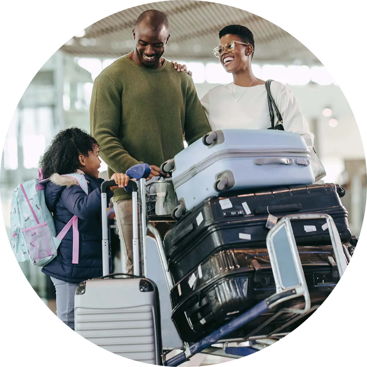 Family with suitcases at airport