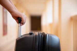 Holding a suitcase in the airport